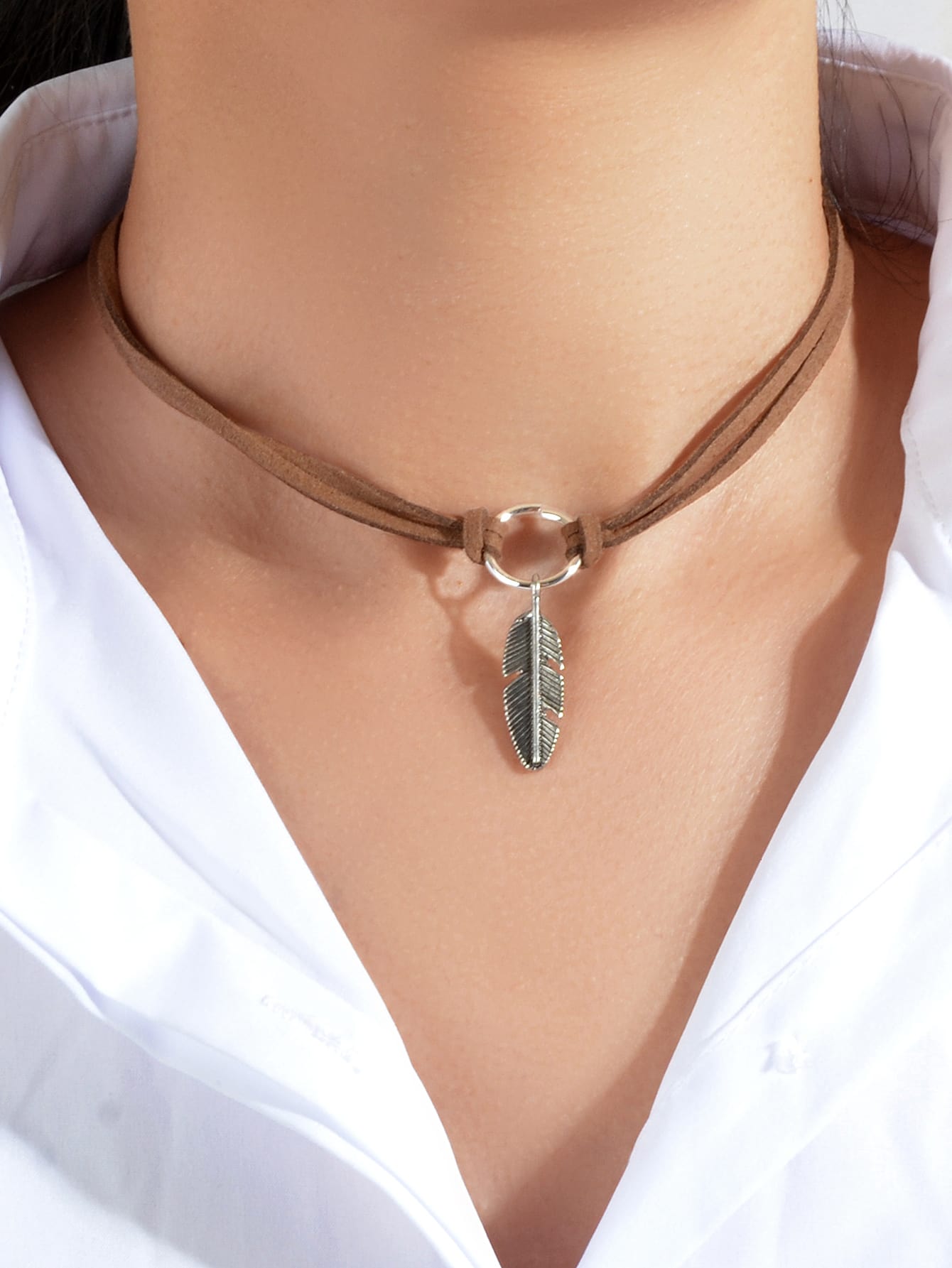 Necklace with a metal leaf pendant