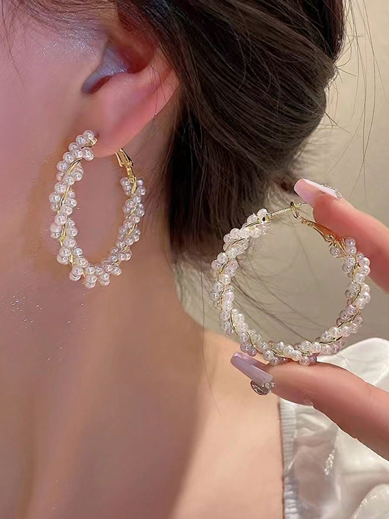 Luxury hoop earrings made of artificial pearls with a unique design and a look and style suitable for high-class women. New arrival in 2023.