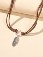 Necklace with a metal leaf pendant