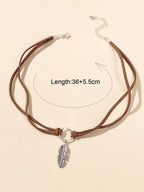 Necklace with a metal leaf pendant