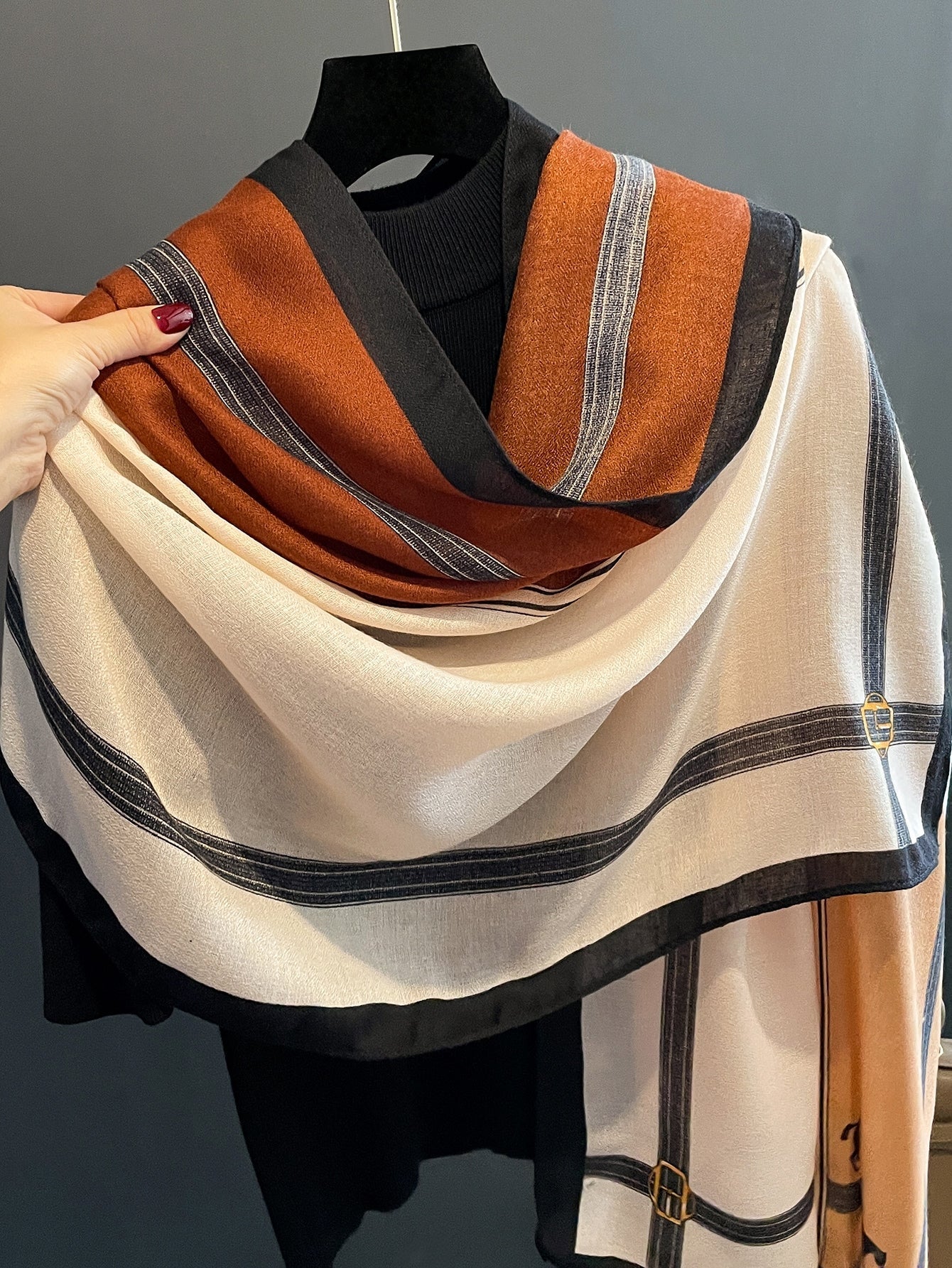 A striped scarf that looks stylish and casual for the weekend.