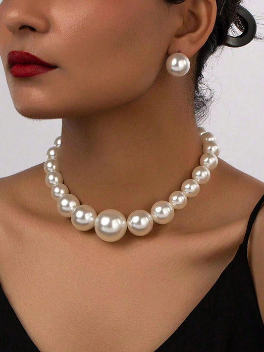 Faux pearl earrings and faux pearl necklace are exaggerated and trendy at the same time