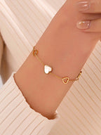 1 قطعة سوار من الفولاذ المقاوم للصدأ مصنوع من الفولاذ المقاوم للصدأ باللون الأسود وتصميم فراغ القلب للنساء بطراز جديد خفيف، مناسب للارتداء اليومي