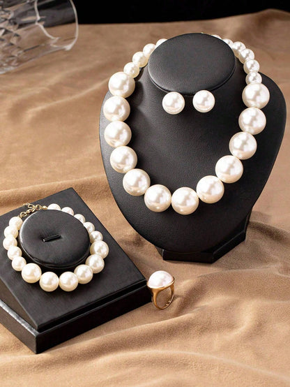 Faux pearl earrings and faux pearl necklace are exaggerated and trendy at the same time