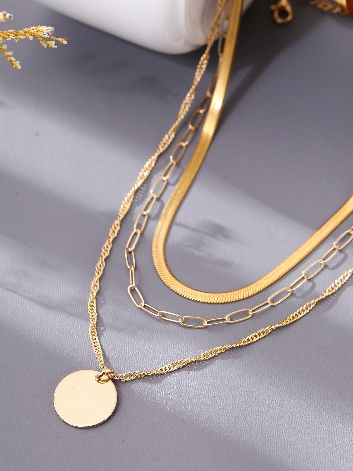 3 pieces of seamlessly designed stainless steel reinforced gold metal necklaces featuring flat and round decorative chains in shiny gold tone, with a gold square clasp, suitable for women to wear during holidays and parties