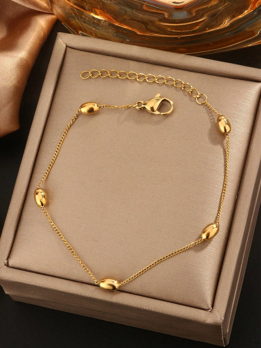 Fashionable and elegant 18k gold plated stainless steel bracelet decorated with many oval beads suitable for ladies to wear in gatherings or as a gift for mothers.