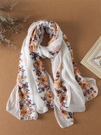 A summer botanical print scarf that is sun-resistant and perfect for desert trips. A delicate beach scarf for women.