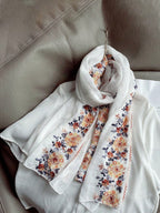 A summer botanical print scarf that is sun-resistant and perfect for desert trips. A delicate beach scarf for women.